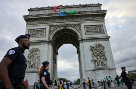 The symbol of the Paralympic movement adorns the Arc de Triomphe