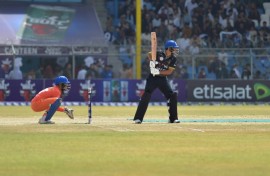 Afghan Cricket players from the Speen Ghar Tigers team (Orange) play against the Mis-e-Ainak Knights (Black) during Afghanistan's leading T20 cricket league 'Shpageeza' at the Kabul Cricket Stadium in Kabul, on August 22, 2024