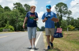 Democratic Party activists Darah Hardy (L) and Yampiere Lugo (R) canvass voters in Laurinburg, North Carolina