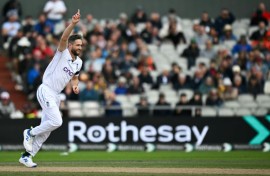 Success: England's Chris Woakes celebrates bowling out Sri Lanka's Nishan Madushka in the first Test at Old Trafford
