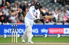 Stylish defiance: Sri Lanka's Kamindu Mendis clips the ball off his pads  at Old Trafford
