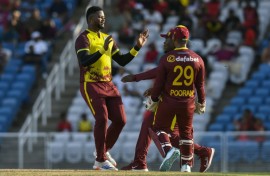 Romario Shepherd of West Indies celebrates the dismissal of Reeza Hendricks of South Africa during the 2nd T20I match at Brian Lara Cricket Academy on Sunday