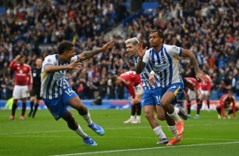 Brighton's Joao Pedro (R) celebrates scoring the winner against Manchester United