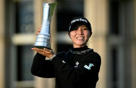 Victory joy: New Zealand's Lydia Ko poses with the trophy after winning the Women's British Open Golf Championship, on the Old Course at St Andrews