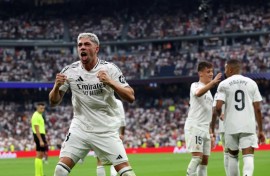 Real Madrid's Uruguayan midfielder Federico Valverde celebrates scoring the opening goal against Valladolid