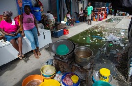 Vendors sell soup near a displacement camp in Port-au-Prince, Haiti in August 2024