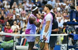 Frances Tiafoe and Ben Shelton shake hands after Tiafoe's victory in their all-American US Open third-round match