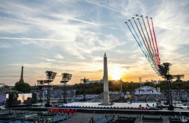 Jets from the French Air Force acrobatic flying team fly over Place de la Concorde during the Paralympics opening ceremony