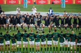 New Zealand players (background) perform the Haka watched by the South African team ahead of a Rugby Championship match in Johannesburg on August 31.
