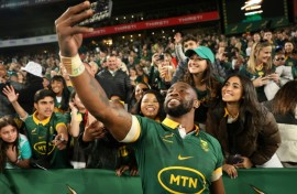 South Africa captain Siya Kolisi takes a selfie with supporters after a 2024 Rugby Championship victory over New Zealand in Johannesburg.