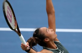 Zheng Qinwen serves in her US Open victory over Jule Niemeier