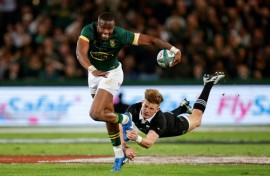 New Zealand's Damian McKenzie (R) tackles South Africa's Aphelele Fassi during their Rugby Championship match last week