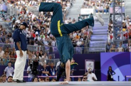 Australia's Rachael Gunn (R), known as Raygun, competes against France's Sya Dembele, known as Syssy, in the Olympic breaking