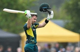 Rapid hundred: Australia's Josh Inglis celebrates his century during the second T20 against Scotland in Edinburgh