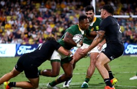 South Africa winger Sibusiso Nkosi (C) is tackled in a 2021 Rugby Championship match against New Zealand.
