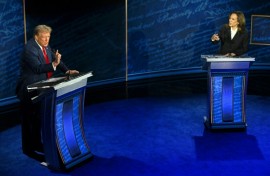 US Vice President and Democratic presidential candidate Kamala Harris (R) and former US President and Republican presidential candidate Donald Trump speak during a presidential debate in Philadelphia, Pennsylvania, on September 10, 2024

