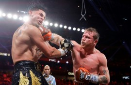Saul 'Canelo' Alvarez lands a punch on the way to a unanimous decision victory over Edger Berlanga in their super middleweight world title bout