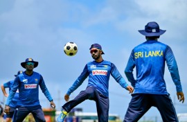 Sri Lanka's captain Dhananjaya De Silva (C) plays football during a practice session ahead of the first Test against New Zealand