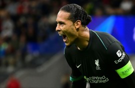 Liverpool defender Virgil van Dijk celebrates scoring against AC Milan