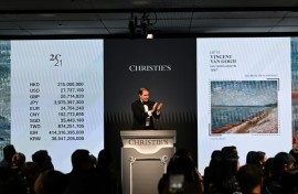 Bids are taken on "Les canots amarrés" by Vincent Van Gogh at a Christie's auction in Hong Kong