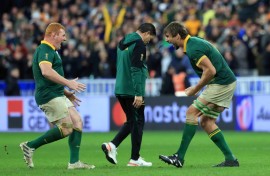 Eben Etzebeth (R) and Steven Kitshoff celebrate after South Africa beat New Zealand in the 2023 Rugby World Cup final in Paris.