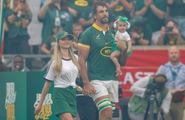 South Africa lock Eben Etzebeth walks on to the Mbombela Stadium pitch accompanied by his wife, Anlia, and baby daughter