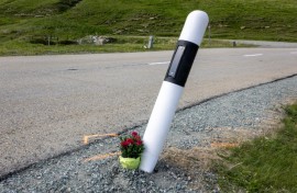 Fans laid flowers by the curve where  Gino Maeder suffered a fatal fall  during a high-speed descent on the Tour of Switzerland in 2023
