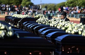 A relative mourns the 45 victims of a bus accident in Botswana in May 