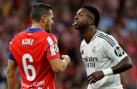 Real Madrid forward Vinicius Junior (R) is hoping to win the Ballon d'Or at the end of October