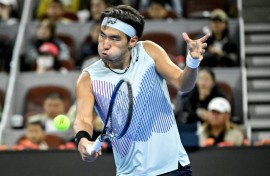 Bright future: China's Bu Yunchaokete hits a return during his defeat to world number one Jannik Sinner in Beijing