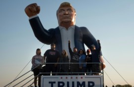 People attend a rally hosted by Republican presidential nominee Donald Trump at Dodge County Airport on October 06, 2024 in Juneau, Wisconsin