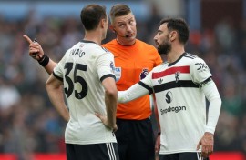 Defender Jonny Evans (left) helped Manchester United battle to a 0-0 draw against Aston Villa