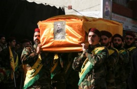 Hezbollah fighters carry the coffin of Mohammed Srur, head of the movement's drone unit, killed on September 26, 2024 in an Israeli strike on Beirut's southern suburbs