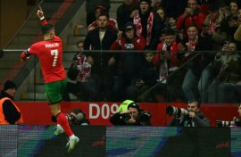 On target again: Cristiano Ronaldo celebrates scoring Portugal's second goal against Poland