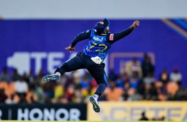 Sri Lanka's captain Charith Asalanka tries to stop the ball during the second T20 against the West Indies