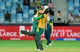 Anneke Bosch (L) leaps into the arms of  Chloe Tryon to celebrate South Africa's eight wicket win over Australia in the semi-final of the Women's T20 World Cup 