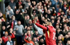 Mohamed Salah celebrates scoring in Liverpool's 2-1 win over Chelsea