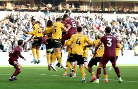 Manchester City's John Stones rises to score the winner against Wolves