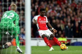 On target: Arsenal midfielder Bukayo Saka pictured scoring the Gunners' opening goal in a 2-2 draw with Liverpool 