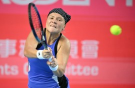 Russia's Diana Shnaider hits a return to Britain's Katie Boulter 