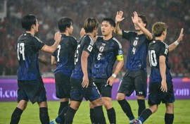Japan hammered a hapless Indonesia side 4-0 on Friday, extending their lead at the top of qualifying for the 2026 World Cup