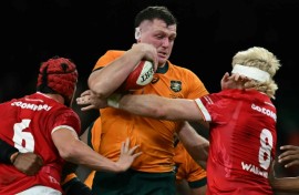 Australia prop Angus Bell is tackled by James Botham and  Aaron Wainwright 