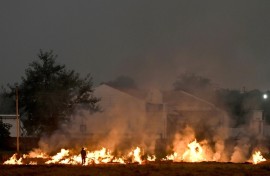 Burning straw stubble, a common but illegal practice in India, sends acrid smoke drifting over the country's densely populated north
