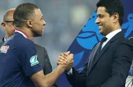 France star Kylian Mbappe (L) and Paris Saint-Germain president Nasser Al-Khelaïfi (R) after the team's French Cup final victory at Lyon on May 25, 2024