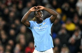 Jeremy Doku celebrates scoring Manchester City's third goal against Nottingham Forest