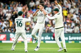Australian captain Pat Cummins (C) celebrates after taking the wicket of India's KL Rahul
