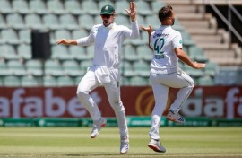 Dane Paterson (R) celebrates after the dismissing Sri Lanka's Dhananjaya de Silva 