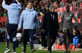 Real Madrid's French defender Ferland Mendy (R) leaves the pitch after an injury against Girona