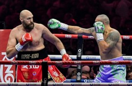 Ukraine's Oleksandr Usyk (blue trunks) gets the measure of Britain's Tyson Fury (red trunks) in Usyk's unanimous decision victory in their heavyweight world title fight at the Kingdom Arena in Riyadh