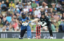 Sri Lanka's Kusal Perera plays a shot as New Zealand wicketkeeper Mitch Hay looks on during the third Twenty20